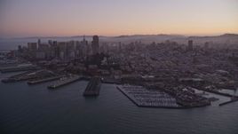 5K aerial stock footage of downtown skyscrapers and Coit Tower, reveal Pier 39, Fisherman's Wharf, San Francisco, California, twilight Aerial Stock Footage | AXSF10_081