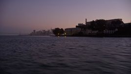 5K aerial stock footage fly low by Alcatraz to reveal skyline of Downtown San Francisco, California, twilight Aerial Stock Footage | AXSF10_087