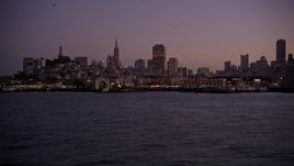5K aerial stock footage of flying by Fisherman's Wharf, revealing Pier 39, San Francisco, California, twilight Aerial Stock Footage | AXSF10_090