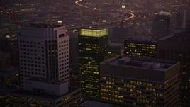 5K aerial stock footage fly over skyscrapers, reveal freeway and police station in South of Market, San Francisco, California, twilight Aerial Stock Footage | AXSF10_093