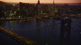 5K aerial stock footage tilt from the Bay Bridge, revealing Downtown San Francisco skyline, California, twilight Aerial Stock Footage | AXSF10_108