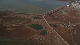 5K aerial stock footage reverse view of sloughs, reveal homes and Sea Breeze Park, Union City, California Aerial Stock Footage | AXSF11_007