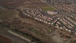5K aerial stock footage of flying away from suburban tract homes, Union City, California Aerial Stock Footage | AXSF11_009