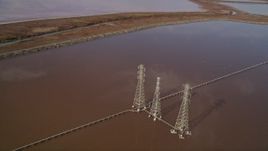 5K aerial stock footage of flying by power lines and Mowry Slough marshlands, Newark, California Aerial Stock Footage | AXSF11_017