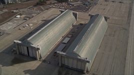 5K aerial stock footage tilt to reveal Hangar Two, Hangar Three at Moffett Field military base, Mountain View, California Aerial Stock Footage | AXSF11_053