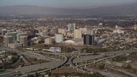 5K aerial stock footage of convention center in Downtown San Jose, California, seen from freeway interchange Aerial Stock Footage | AXSF12_011