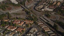 5K aerial stock footage of a reverse view of the I-280 freeway interchange and tract homes, San Jose, California Aerial Stock Footage | AXSF12_017