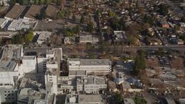5K aerial stock footage reverse view of suburban neighborhoods, reveal Santa Clara Valley Medical Center, San Jose, California Aerial Stock Footage | AXSF12_018