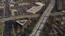 5K aerial stock footage reverse view of neighborhoods beside Interstate 280, reveal shopping center, San Jose, California Aerial Stock Footage | AXSF12_024