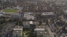 5K aerial stock footage tilt from freeway, revealing Apple Headquarters office buildings, Cupertino, California Aerial Stock Footage | AXSF12_029