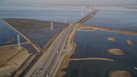 5K aerial stock footage of flying over Highway 84 freeway, revealing Dumbarton Bridge, Menlo Park, California Aerial Stock Footage | AXSF12_062