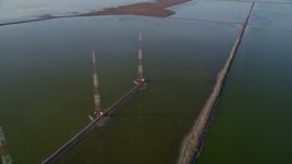 5K aerial stock footage of flying by wetlands, tilt down revealing radio towers, Fremont, California Aerial Stock Footage | AXSF12_070