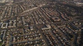 5K aerial stock footage reverse view of residential neighborhoods and shopping center by I-880, San Leandro, California Aerial Stock Footage | AXSF12_085