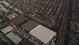 5K aerial stock footage fly away from suburban neighborhoods, warehouses by I-880 freeway, San Leandro, California Aerial Stock Footage | AXSF12_086