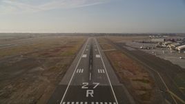 5K aerial stock footage tilt from golf course to reveal and approach Oakland International Airport, California Aerial Stock Footage | AXSF12_089