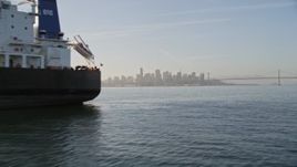 5K aerial stock footage flyby oil tanker on San Francisco Bay, reveal Downtown San Francisco skyline, California Aerial Stock Footage | AXSF13_003