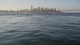 5K aerial stock footage fly low over bay toward downtown, tilt to the water, Downtown San Francisco, California Aerial Stock Footage | AXSF13_006