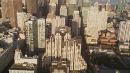5K aerial stock footage of a downtown hotel by skyscrapers in Downtown San Francisco, California Aerial Stock Footage | AXSF13_015