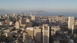 5K aerial stock footage of flying over Stockton Street with view of Mark Hopkins Hotel, Alcatraz in Nob Hill, San Francisco, California Aerial Stock Footage | AXSF13_017