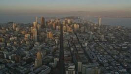5K aerial stock footage of flying by Market Street and skyscrapers in Downtown San Francisco, California, sunset Aerial Stock Footage | AXSF14_004