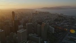 5K aerial stock footage of panning across downtown buildings and skyscrapers in Downtown San Francisco, California, sunset Aerial Stock Footage | AXSF14_010