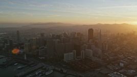 5K aerial stock footage of flying by skyscrapers at sunset in Downtown San Francisco, California Aerial Stock Footage | AXSF14_012