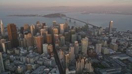 5K aerial stock footage pan across Downtown San Francisco, California, sunset, with views of San Francisco Bay and Bay Bridge Aerial Stock Footage | AXSF14_017