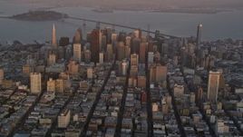 5K aerial stock footage video of towering skyscrapers and city buildings at sunset in Downtown San Francisco, California Aerial Stock Footage | AXSF14_022