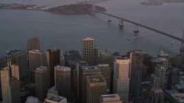 5K aerial stock footage tilt from city skyscrapers to reveal Bay Bridge, Downtown San Francisco, California, sunset Aerial Stock Footage | AXSF14_026