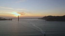 5K aerial stock footage of the setting sun behind the Golden Gate Bridge, San Francisco, California, sunset Aerial Stock Footage | AXSF14_037