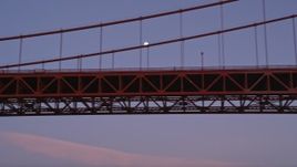 5K aerial stock footage flyby Golden Gate Bridge, moon visible between cables, San Francisco, California, twilight Aerial Stock Footage | AXSF14_052