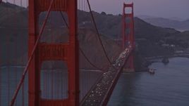 5K aerial stock footage flyby heavy traffic on the Golden Gate Bridge, San Francisco, California, twilight Aerial Stock Footage | AXSF14_059