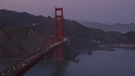 5K aerial stock footage of a reverse view of traffic on the Marin side of the Golden Gate Bridge, San Francisco, California, twilight Aerial Stock Footage | AXSF14_060