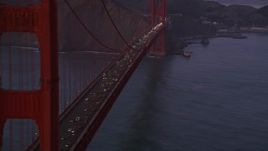5K aerial stock footage flyby heavy traffic on the Golden Gate Bridge, San Francisco Bay, San Francisco, California, twilight Aerial Stock Footage | AXSF14_061
