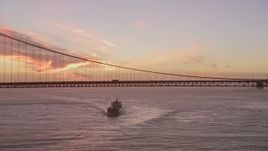 5K aerial stock footage a view of an oil tanker approaching the Golden Gate Bridge, San Francisco, California, twilight Aerial Stock Footage | AXSF14_069