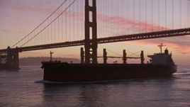 5K aerial stock footage flyby an oil tanker, reveal Golden Gate Bridge, San Francisco, California, twilight Aerial Stock Footage | AXSF14_073