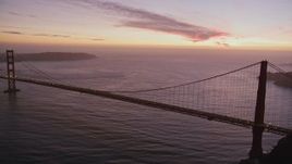 5K aerial stock footage of flying by the iconic Golden Gate Bridge with traffic, San Francisco, California, twilight Aerial Stock Footage | AXSF14_080