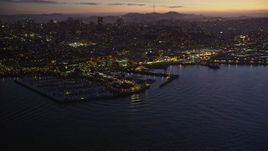 5K aerial stock footage of flying away from Pier 39. and Fisherman's Wharf in San Francisco, California, twilight Aerial Stock Footage | AXSF14_093