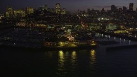 5K aerial stock footage approach and fly over Pier 39 in San Francisco, California, night Aerial Stock Footage | AXSF14_095