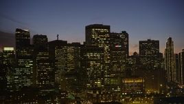 5K aerial stock footage low approach to downtown skyline, ascend close to the skyscrapers, Downtown San Francisco, California, twilight Aerial Stock Footage | AXSF14_107