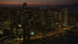 5K aerial stock footage flyby the downtown skyline, and reveal part of the Bay Bridge, San Francisco, California, night Aerial Stock Footage | AXSF14_109