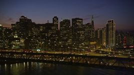 5K aerial stock footage fly by heavy traffic crossing the Bay Bridge with the skyline in background, Downtown San Francisco, California, night Aerial Stock Footage | AXSF14_117
