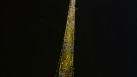 5K aerial stock footage tilt from bird's eye of traffic to fly over the Bay Bridge, San Francisco, California, night Aerial Stock Footage | AXSF14_122