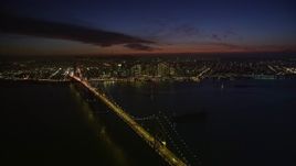 5K aerial stock footage of a view of the Bay Bridge and Downtown San Francisco, California, night Aerial Stock Footage | AXSF14_125