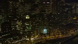 5K aerial stock footage of Downtown San Francisco skyscrapers seen while flying by the Bay Bridge, California, night Aerial Stock Footage | AXSF14_131
