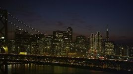 5K aerial stock footage of Downtown San Francisco skyline seen while passing by the Bay Bridge, California, night Aerial Stock Footage | AXSF14_133