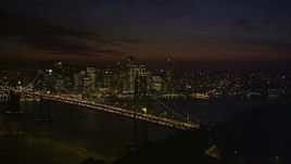 5K aerial stock footage Bay Bridge and Downtown San Francisco skyline, seen from Yerba Buena Island, California, night Aerial Stock Footage | AXSF14_136