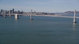 5K aerial stock footage of tilting from the bay revealing Bay Bridge, San Francisco, California Aerial Stock Footage | AXSF15_003