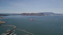 5K aerial stock footage of approaching an oil tanker sailing San Francisco Bay, California with a view of the Golden Gate Bridge Aerial Stock Footage | AXSF15_013