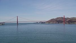 5K aerial stock footage of approaching boat on the bay, tilt to reveal Golden Gate Bridge, San Francisco, California Aerial Stock Footage | AXSF15_017